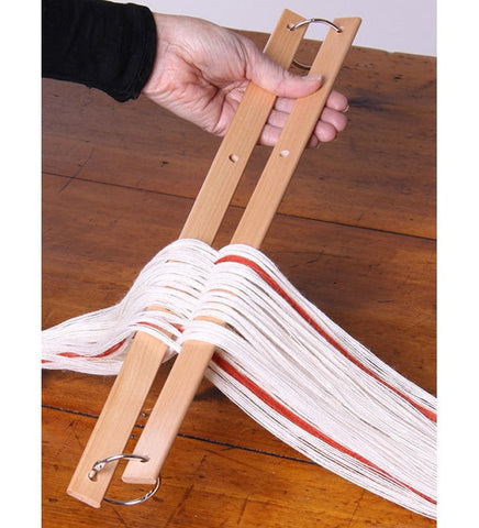 Ashford cross and warp sticks holding a weaving cross