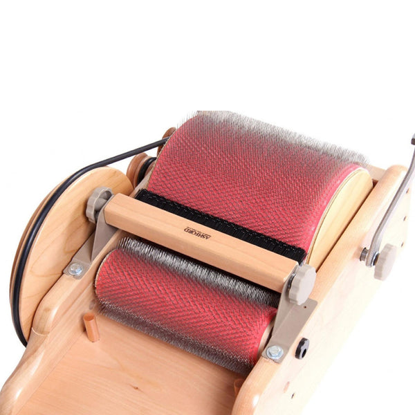 Ashford adjustable packer brush fitted to a drum carder
