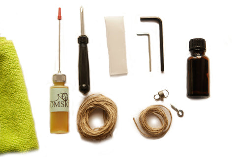 Kromski spinning wheel maintenance kit with cleaning cloth, oil, wax, tools, bands and stain