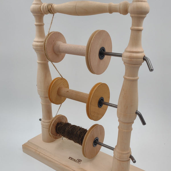 Kromski Vertical Tensioned Lazy Kate holding three spinning-wheel bobbins
