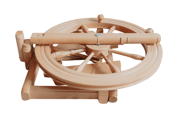 kromski sonata spinning wheel folded. Wooden spinning wheel on a white background