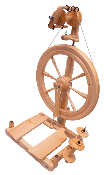 Wooden kromski sonata encore spinning wheel on a white background